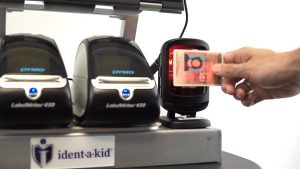 Visitor scanning their license with Ident-A-Kid Visitor Management.